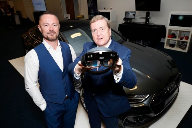 Pat Breen TD Minister of State for Trade, Employment, Business, EU Digital Single Market and Data Protection using a VR headset software developed by vStream technology for Audi. Photograph: Conor McCabe