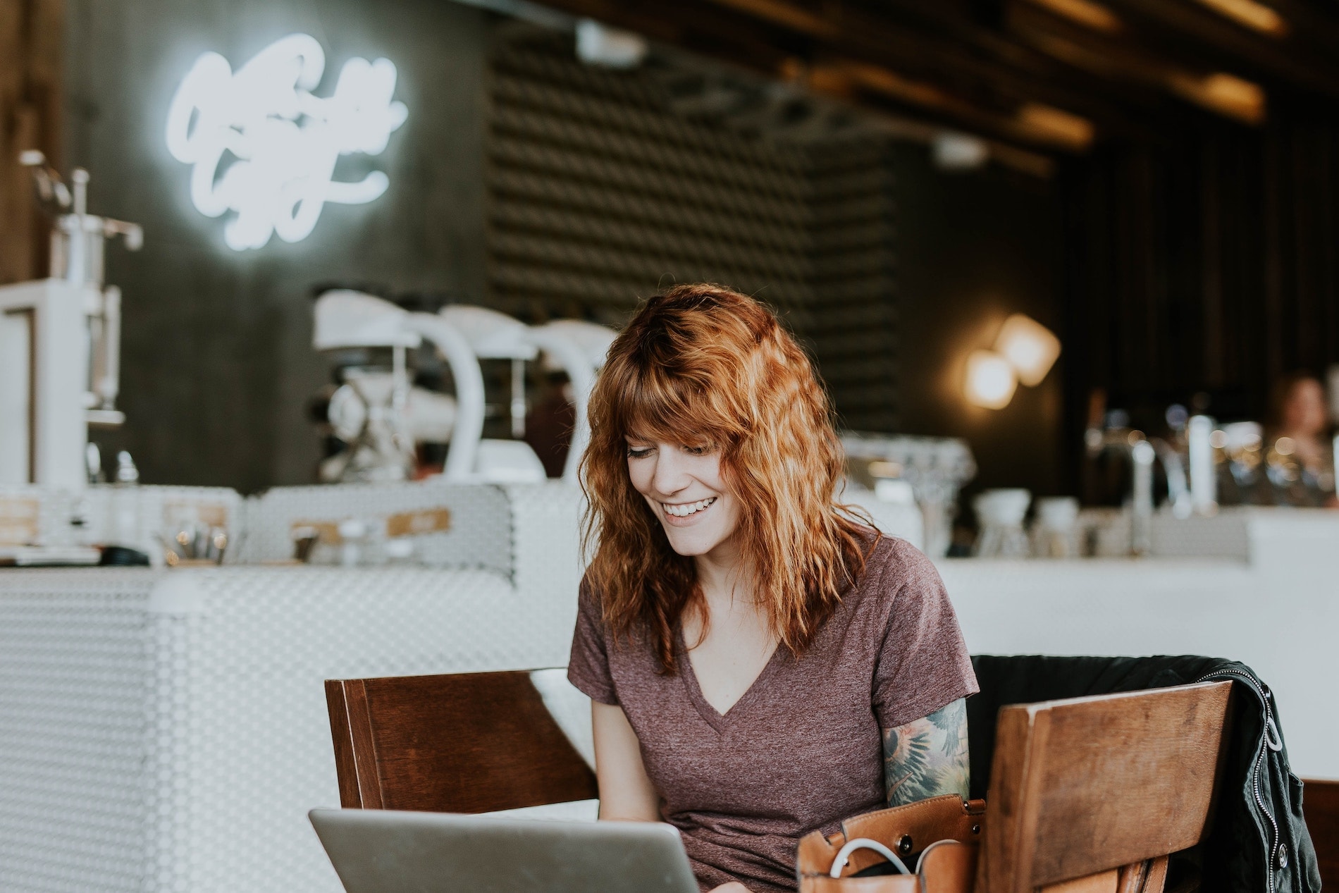 Young woman smiling at laptop